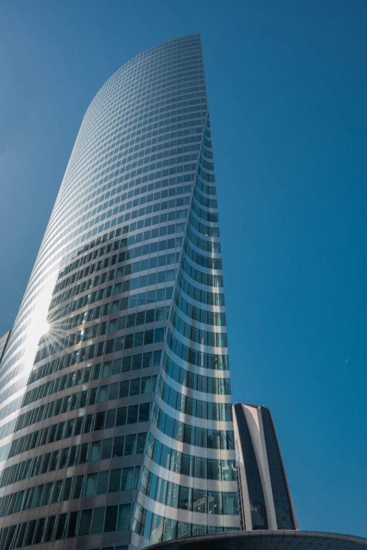 A tall building with a sky background